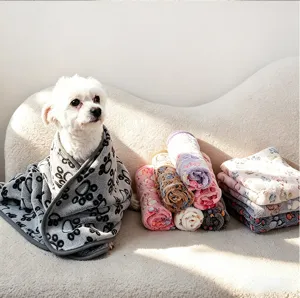 Soft flannel pet blanket with cute paw print design, warm resting mat for dogs and cats.