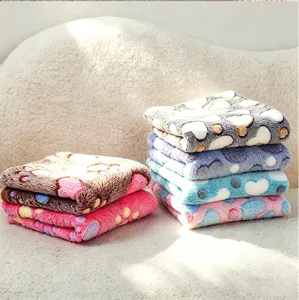 Cozy flannel pet blanket with cute paw print design, soft and warm mat for dogs and cats.