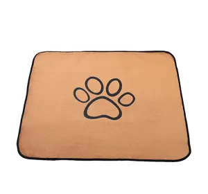 Washable waterproof pet pee pad with cute paw print design, soft brown coral fleece mat.