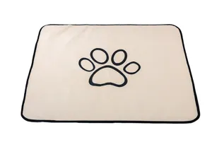 Detail view of the washable pet pee pad, soft coral fleece with cute paw print design.