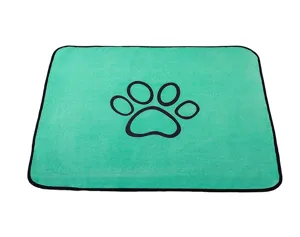 Green pet pee mat coral fleece dog mat with black paw print and edge for daily use.
