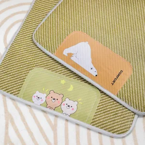 Pet cooling mat for summer, breathable woven pet sleeping pad with cute cartoon bear patches.