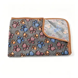Soft fleece pet blanket with cute paw print design, cozy warm dog and cat sleeping mat.