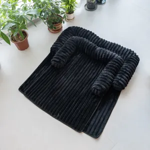Black plush ribbed pet sofa bed with thick raised bolster for dogs and cats warm main view