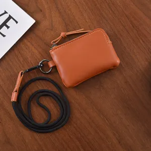 Mini leather coin purse with black lanyard, stylish portable card holder and small zipper pouch.