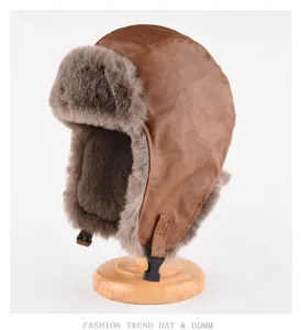 Vintage brown leather ushanka bomber hat with thick warm faux fur ear flaps for winter.