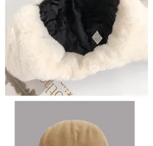 Winter bomber hat interior detail showing plush white faux fur and black quilted lining.