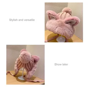 Pink cute cat ear knitted plush trapper hat detail view showing soft fluffy texture and pompom.