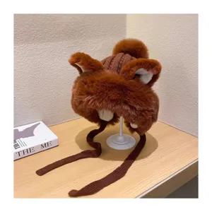 Brown plush trapper hat detail, cozy winter earflap design with cute animal ears and straps.