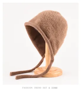 Cute plush winter bonnet hat with earflaps and long ties, cozy knit beanie for women.