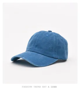 Blue washed denim baseball cap detail, soft crown, vintage casual design for spring and summer.