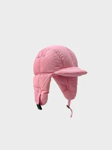 Close-up detail of the pink quilted ushanka hat showing soft down-cotton texture and ear flaps.