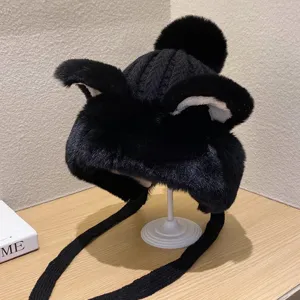 Winter warm black plush earflap hat with cute animal ears and pom-pom, main product view display.