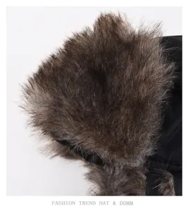 Detail view of winter trapper hat showing soft brown faux fur lining and durable black fabric.