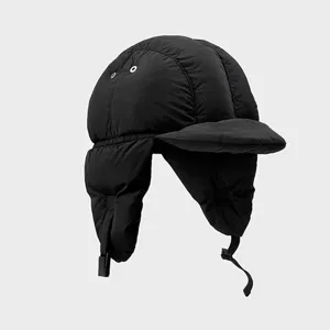 Black quilted winter trapper hat with earflaps and visor, warm windproof pilot bomber cap.
