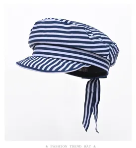 Blue and white striped sailor hat, fashionable newsboy cap with ribbon detail for women.