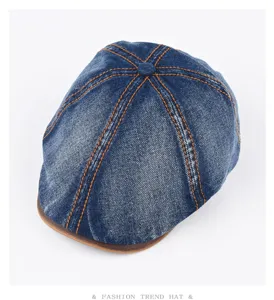 Classic washed denim ivy cap with leather brim and contrast orange stitching for men women.