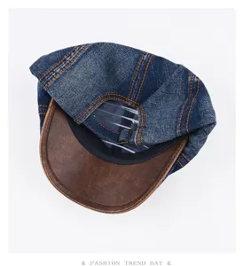 Vintage washed denim flat cap with brown leather brim, retro newsboy hat for men and women.