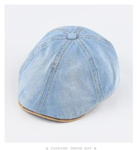 Vintage washed denim flat cap for men and women, stylish newsboy hat with leather brim.