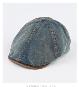 Retro washed denim ivy cap detail showing contrast orange stitching and leather brim.