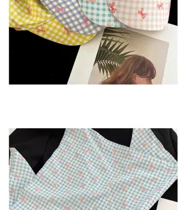 Detailed view of French plaid bow printed cotton fabric and multi-color sun hat designs.