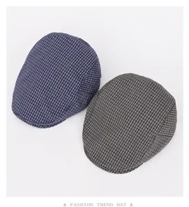 Retro plaid flat cap detail showing fabric texture, classic British style spring autumn hat.