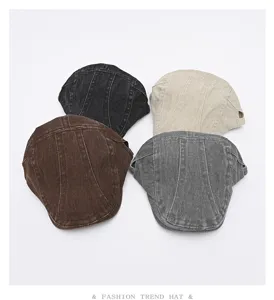 Detailed view of four vintage washed denim ivy newsboy painter caps in assorted colors.