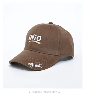 Brown baseball cap with front embroidery and wide brim, stylish casual hat for daily wear.
