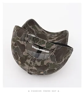 Detailed view of the camouflage baseball cap showing adjustable metal buckle and inner tape.