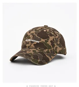 Detail view of the camouflage baseball cap with front embroidery, soft crown and curved brim.