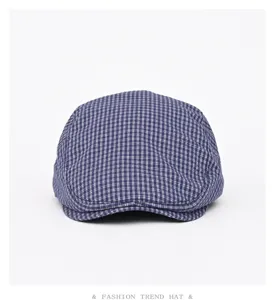 Detailed close-up view of the blue and white plaid ivy cap, showing fine fabric texture and shape.