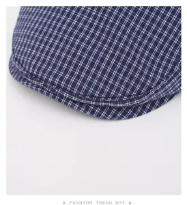 Detailed view of retro navy blue checkered flat cap, classic plaid pattern fabric closeup.
