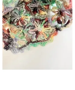Handmade crochet floral beanie hat detail, colorful hollow knit cap for women's summer.