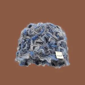 Handmade crochet hollow beanie hat for women, breathable knit cap for autumn and travel.