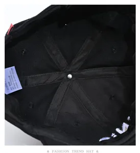 Black baseball cap interior detail view showcasing quality stitching and comfortable lining design.