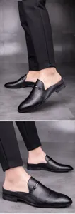 Men's leather half slippers casual backless loafers detail view showing embossed texture.