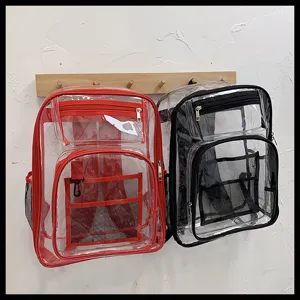 Clear waterproof PVC backpack detail showing double zipper pockets, mesh storage compartments.