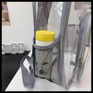 Detail shot of clear PVC backpack side pocket with water bottle, transparent school book bag.