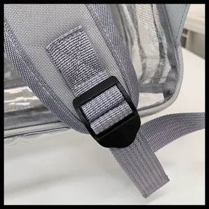 Close-up detail of the adjustable black plastic buckle on a sturdy gray nylon strap.