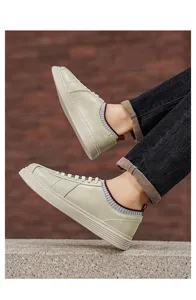 Detail shot of men's casual retro sneakers, slip-on soft sole design with striped collar.