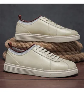 Detail view of men's casual retro sneakers in beige with thick soft soles and rope prop.