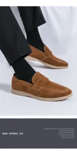 Detailed view of men's brown suede slip-on loafers featuring classic stitching and comfortable sole.