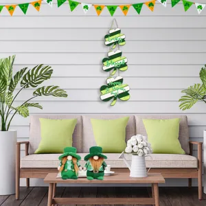St. Patrick's Day wooden shamrock hanging sign and gnome decor set for holiday party.