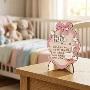 Personalized wooden baby birth milestone plaque with cute pink bow and goose design for newborn gift.
