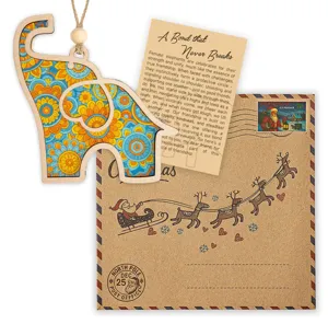 Handcrafted wooden elephant hanging ornament with friendship story card, perfect birthday gift.