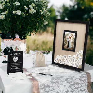 Wooden wedding guest book drop top frame set with heart pieces and sign for reception decor.