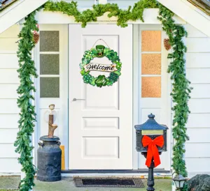 St. Patrick's Day wooden clover wreath hanging sign detail view, festive door decor.