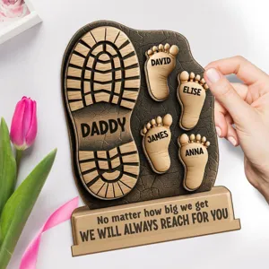 Detailed view of custom wooden boot footprint plaque with personalized family names for dad.