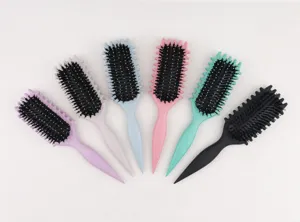 Close-up detail view of multi-color hair brushes with soft bristles and ergonomic handles.