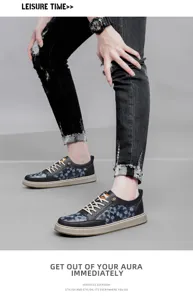Men's casual leather sneakers detail, stylish contrast color board shoes with lace-up design.